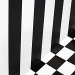 Painting stripes - a black and white checkered floor and wall